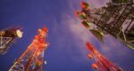 group of cell towers night lighting